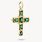 Gold cross pendant with green gemstones on a white background