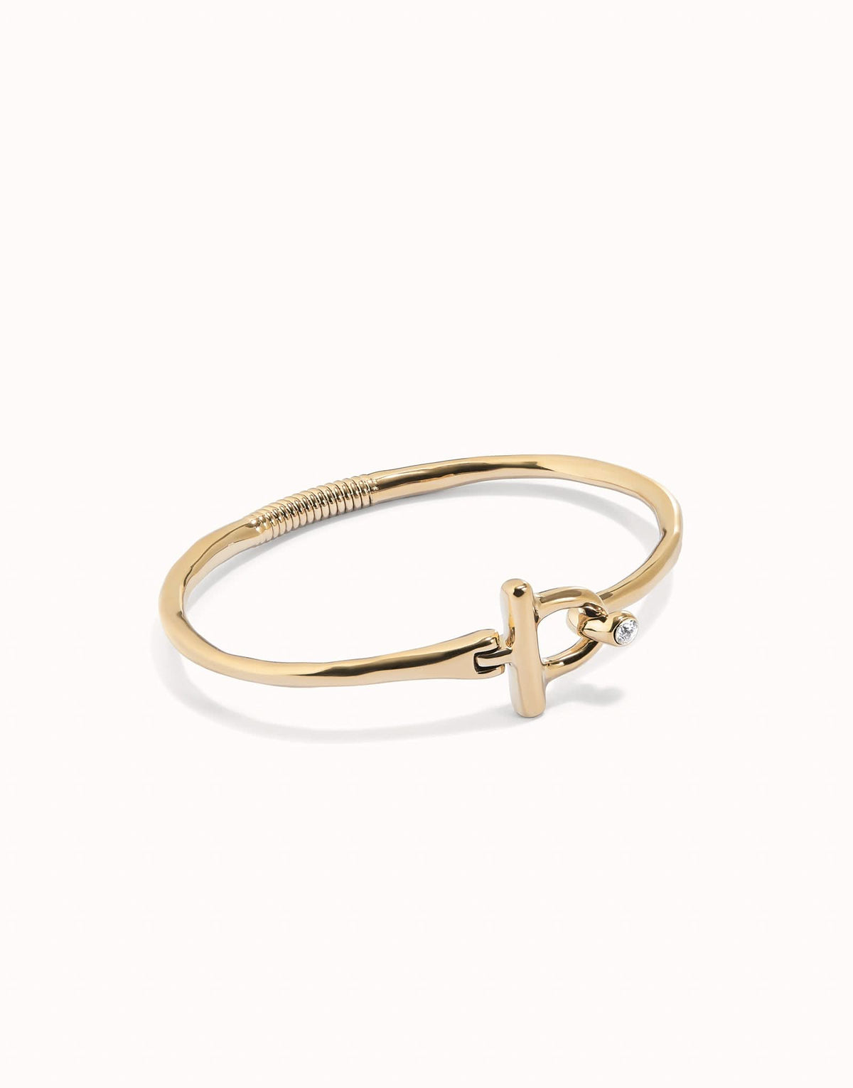 Stunning close-up of the 18k Gold Plated Ser Indomable White Bangle Bracelet PUL2449BLNORO0, highlighting the intricate craftsmanship and luxurious finish.