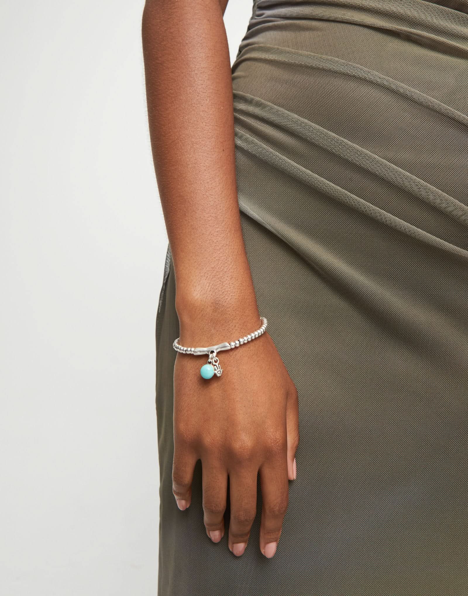 Chic Sterling Silver Plated Ser Fascinante Turquoise Bracelet, embodying an enigmatic aura with its artisan details and vibrant colors.