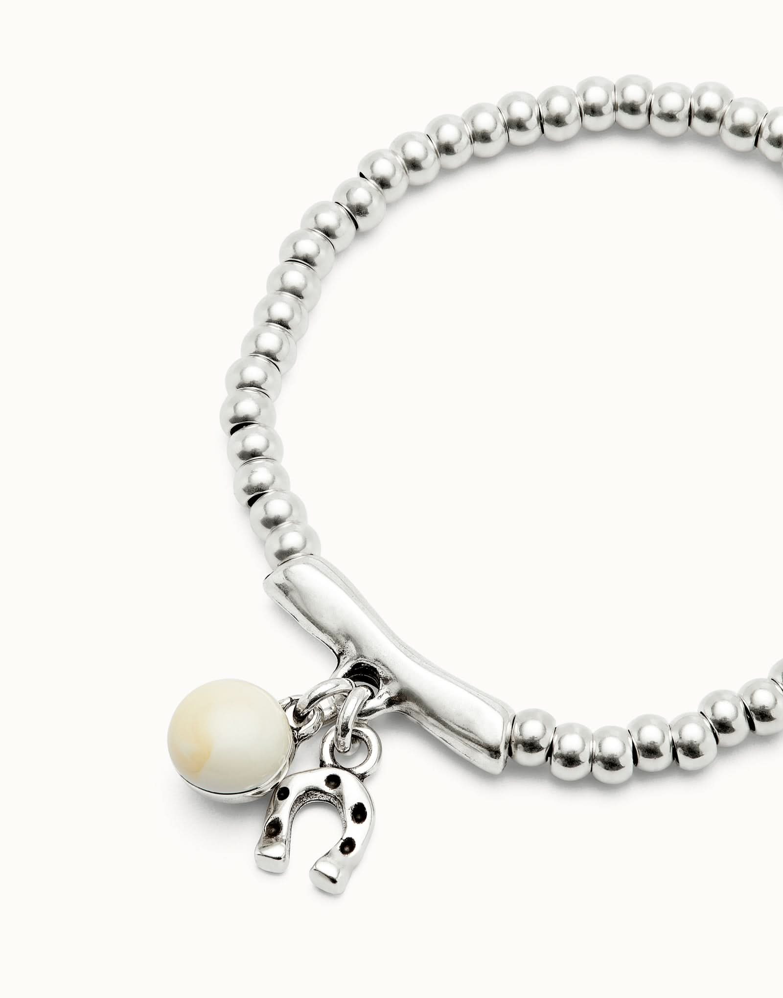 Artistic view of the Sterling Silver Plated Ser Fascinante White Bracelet PUL2537MFLMTL0 emphasizing its unique design and captivating murano glass elements. A true statement luxury bracelet.
