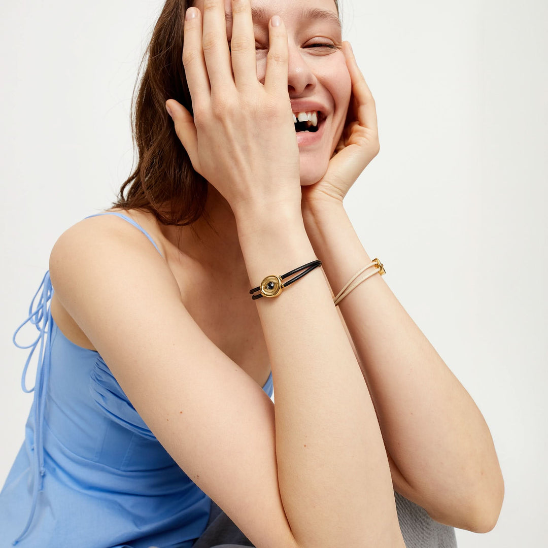 Double Black Leather Metal Alloy Eye Detail Pleated Gold 18K Crystal Bracelet PUL2601NGRORO0M