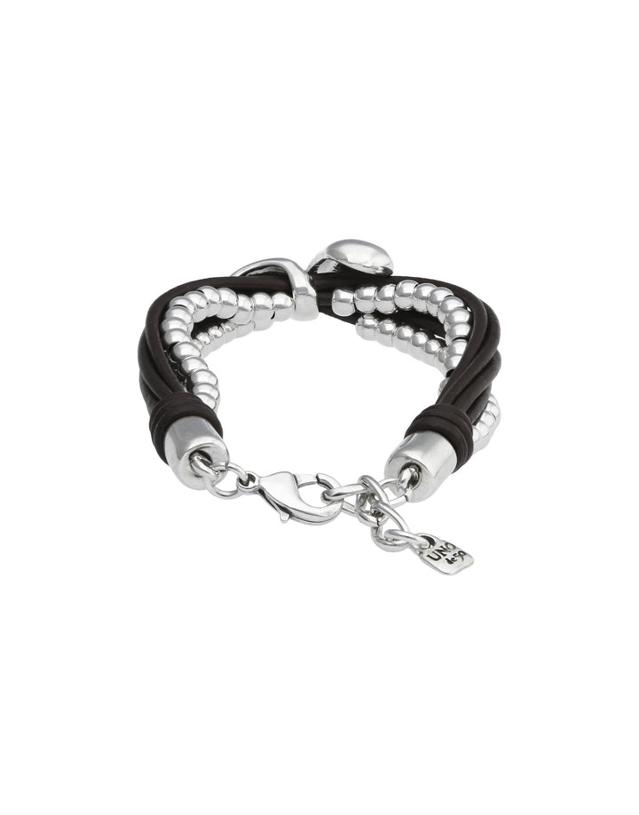 A multi-strand bracelet featuring black braided cord, silver beaded strands, silver cylindrical beads, and a silver lobster clasp with a small chain and charm, shown on a plain white background.