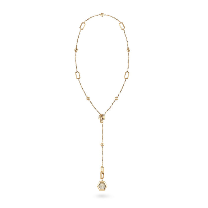Gold necklace with a pendant on a white background