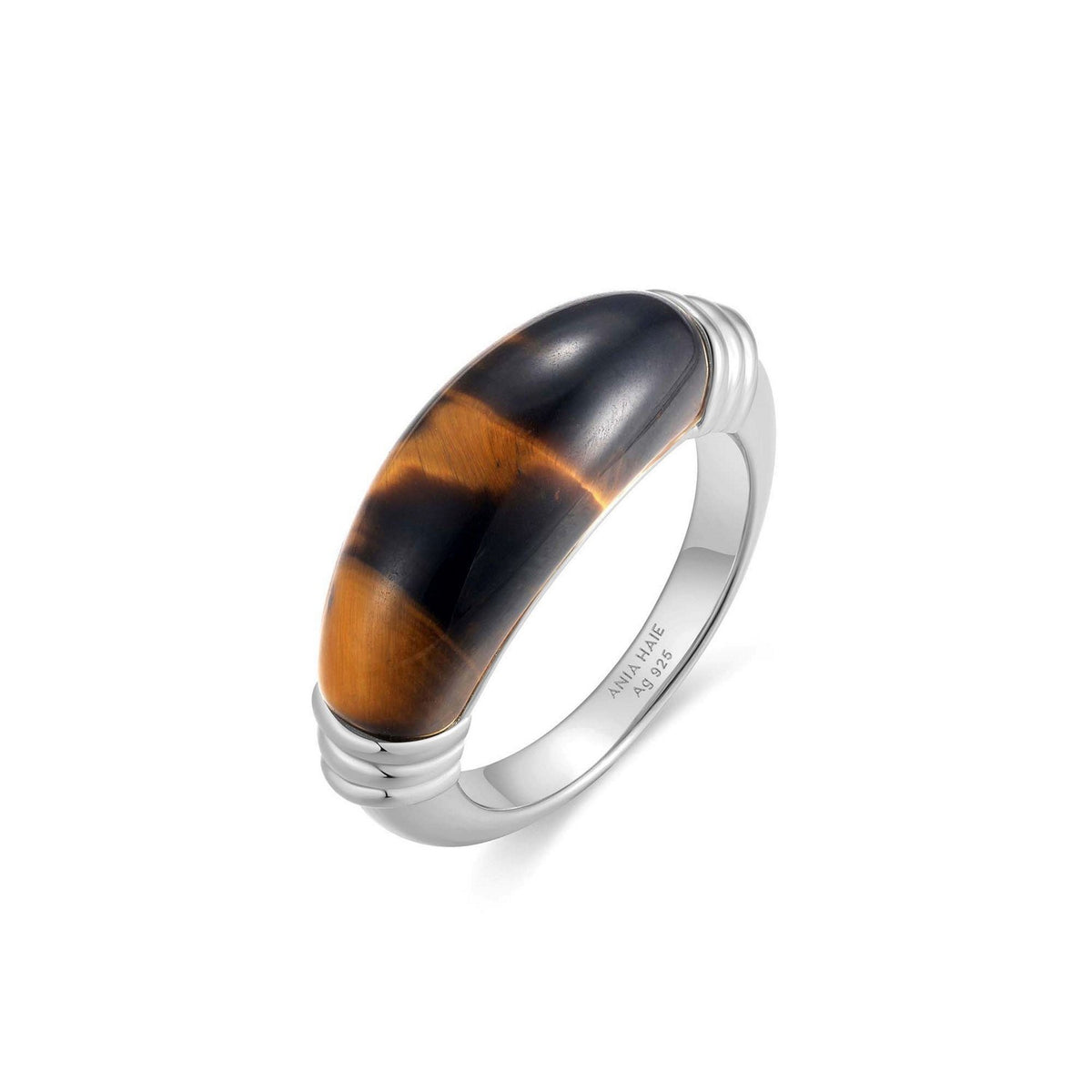 Silver ring with a tortoiseshell band on a white background