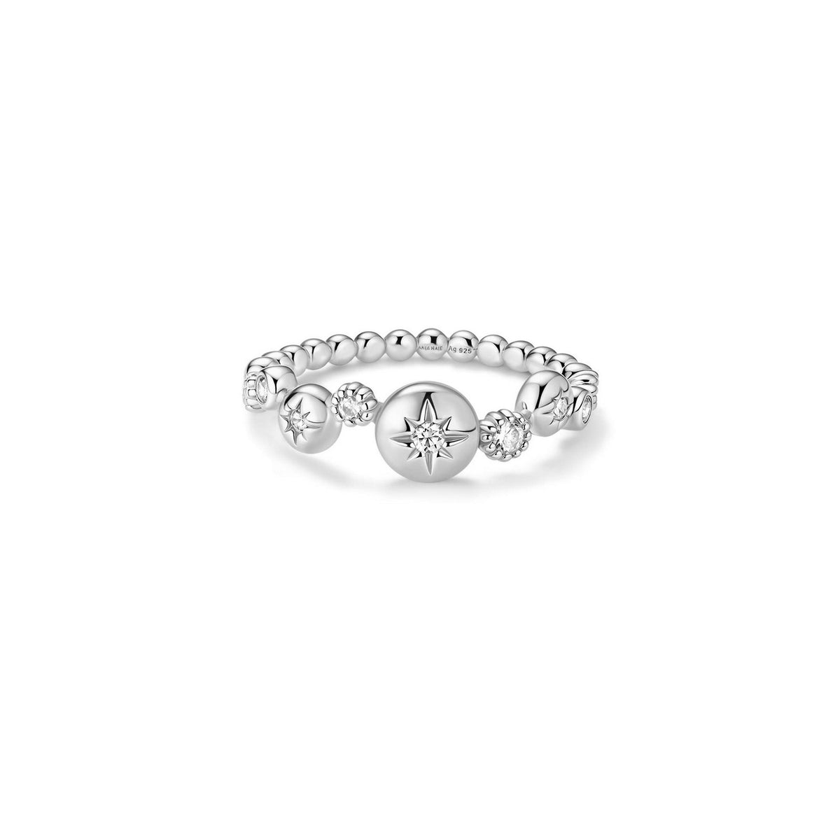 Silver ring with round embellishments on a white background