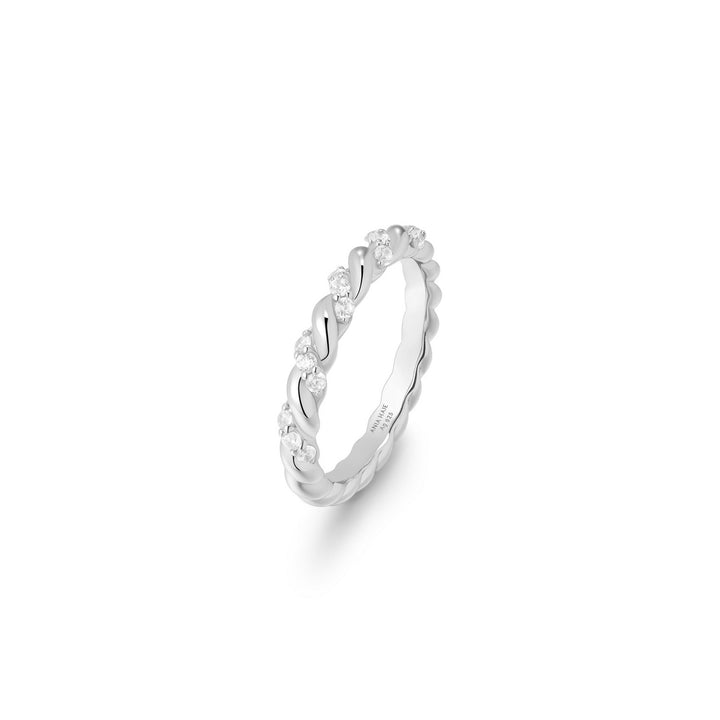 Silver ring with small stones on a white background