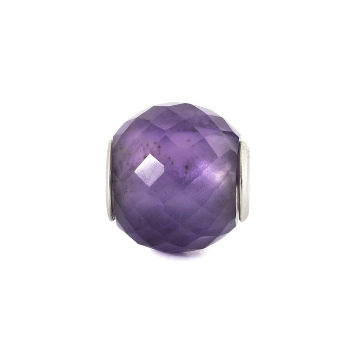 Faceted purple gemstone charm on a white background