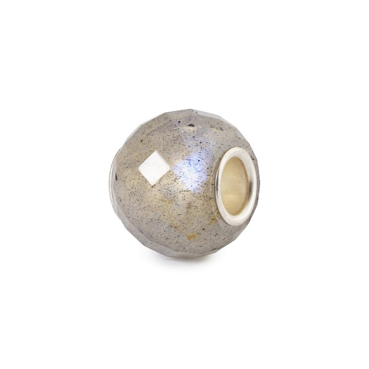 Silver bead with a white stone on a white background