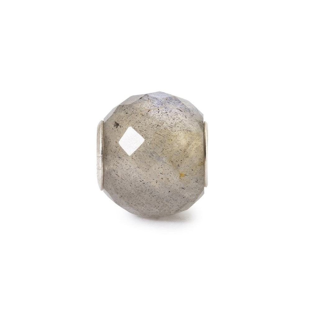 A faceted gray stone bead with a small diamond-shaped cutout, set in a silver-toned metal frame, shown on a plain white background.