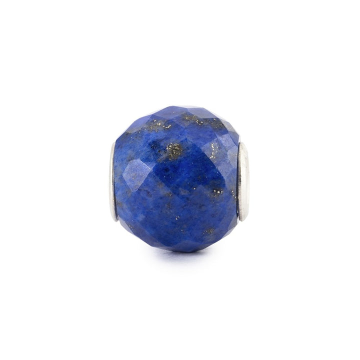 Blue faceted bead with silver accents on a white background