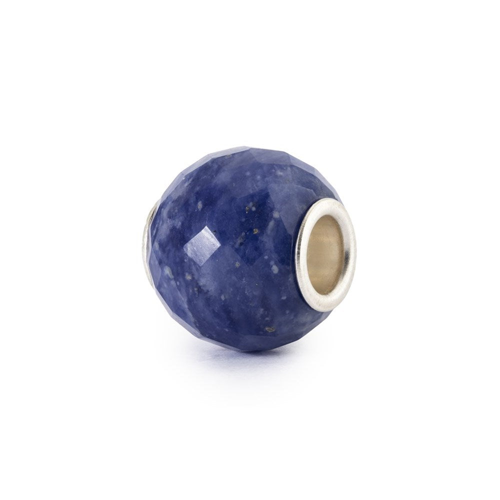 Blue bead with silver accent on a white background