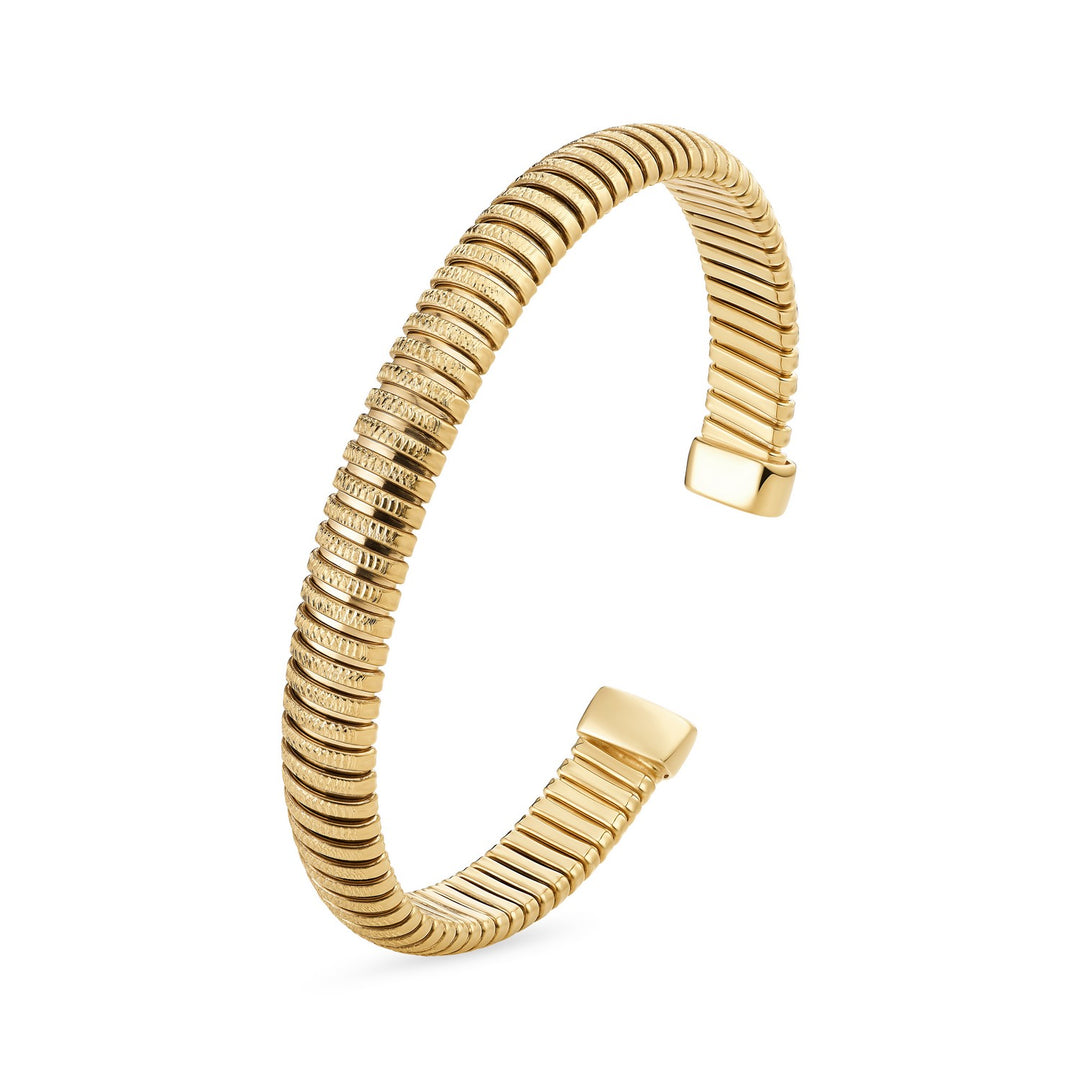 Gold bracelet with ribbed texture on a white background