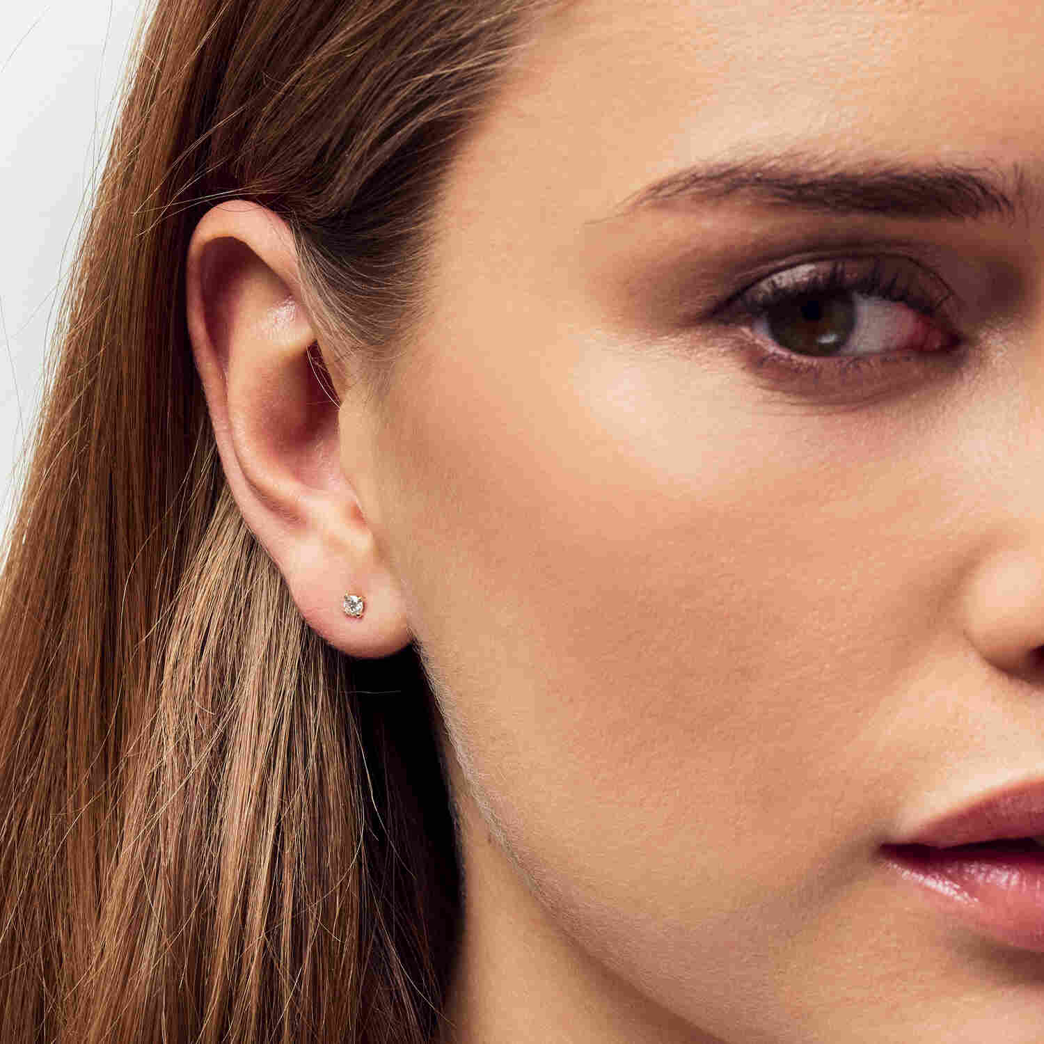 Elegant side view of the 14k Yellow Gold Venice Medio Diamond Earrings SJ-E2502-WD-YG, highlighting the exquisite round brilliant cut diamonds.