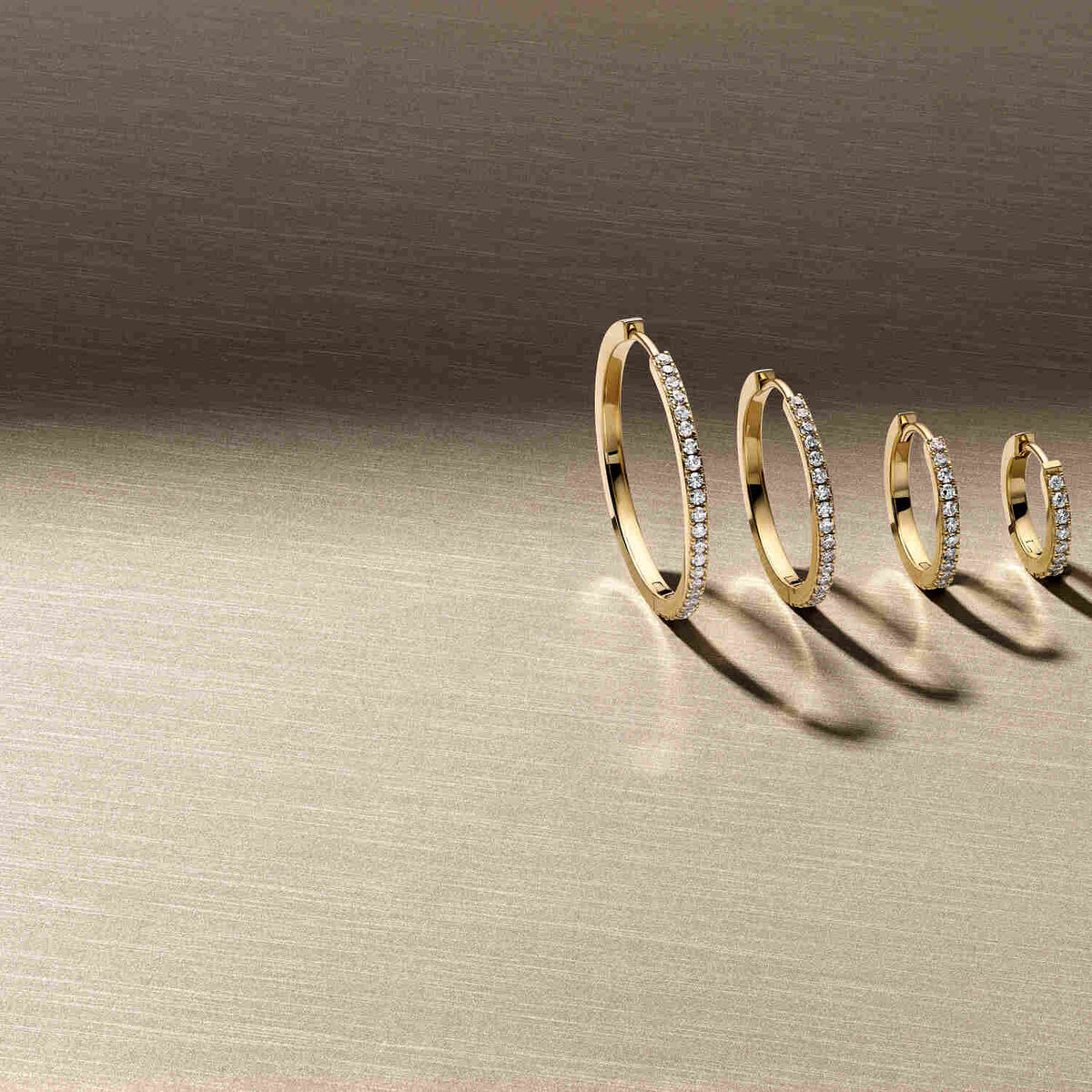 Collection of 14k Yellow Gold Alba Medio Single Diamond Earrings SJ-E2511-WD-YG-1 displayed in various sizes, highlighting the luxury of lab-grown diamonds set in yellow gold, perfect for elegant occasions.