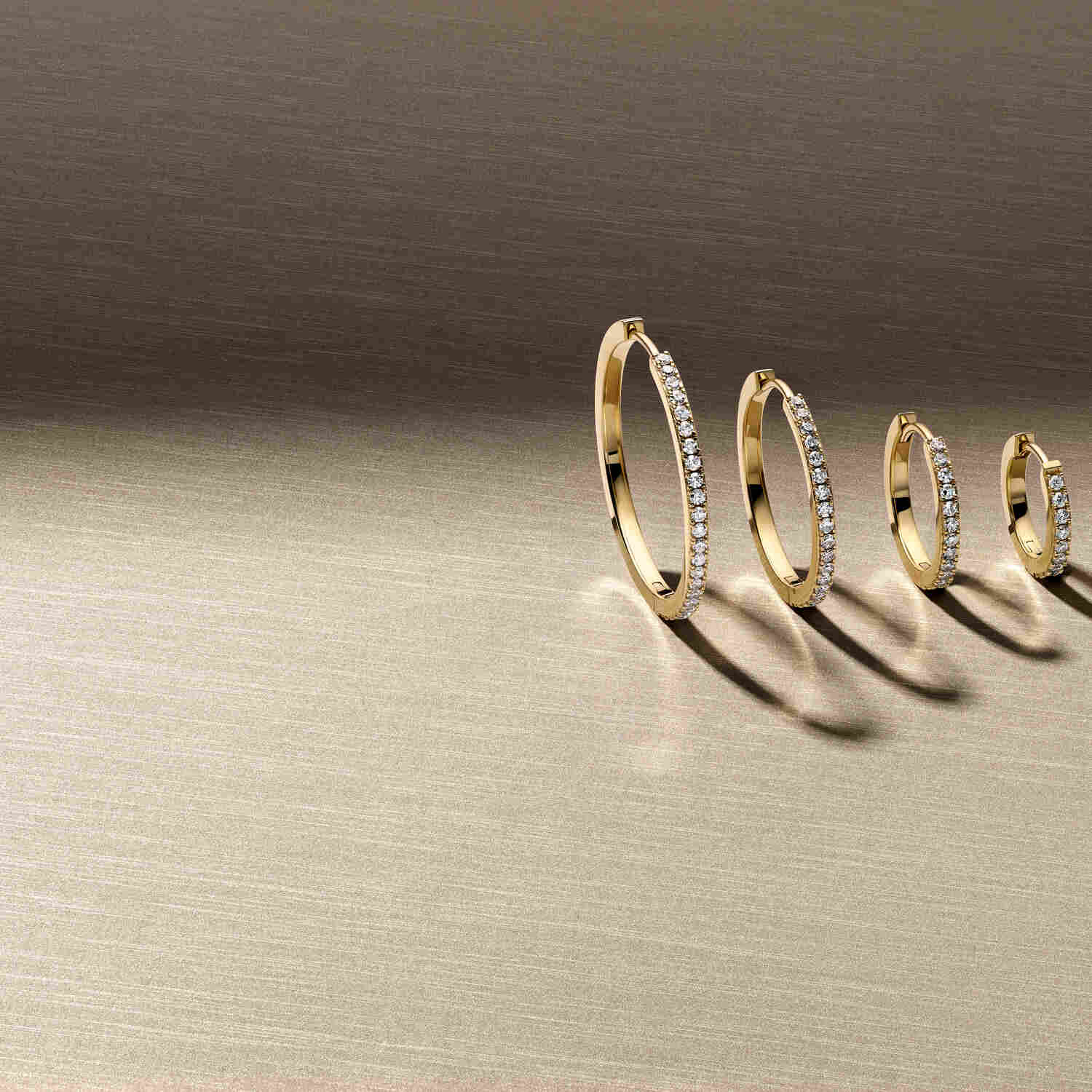 Collection of 14k Yellow Gold Alba Medio Single Diamond Earrings SJ-E2511-WD-YG-1 displayed in various sizes, highlighting the luxury of lab-grown diamonds set in yellow gold, perfect for elegant occasions.