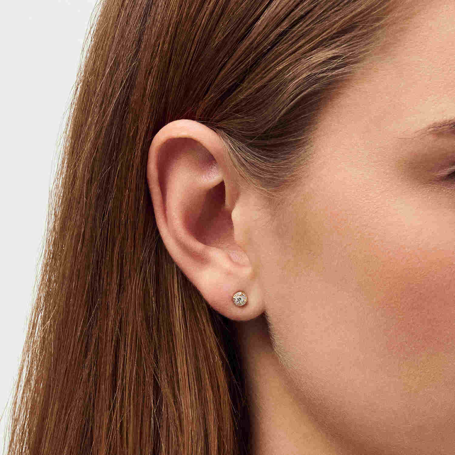 Side view of a model displaying 14k Yellow Gold Rome Diamond Earrings SJ-E2555-WD-YG, illustrating the refined beauty and design of these exquisite earrings.