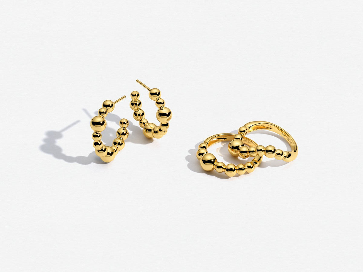 Gold hoop earrings on a white background