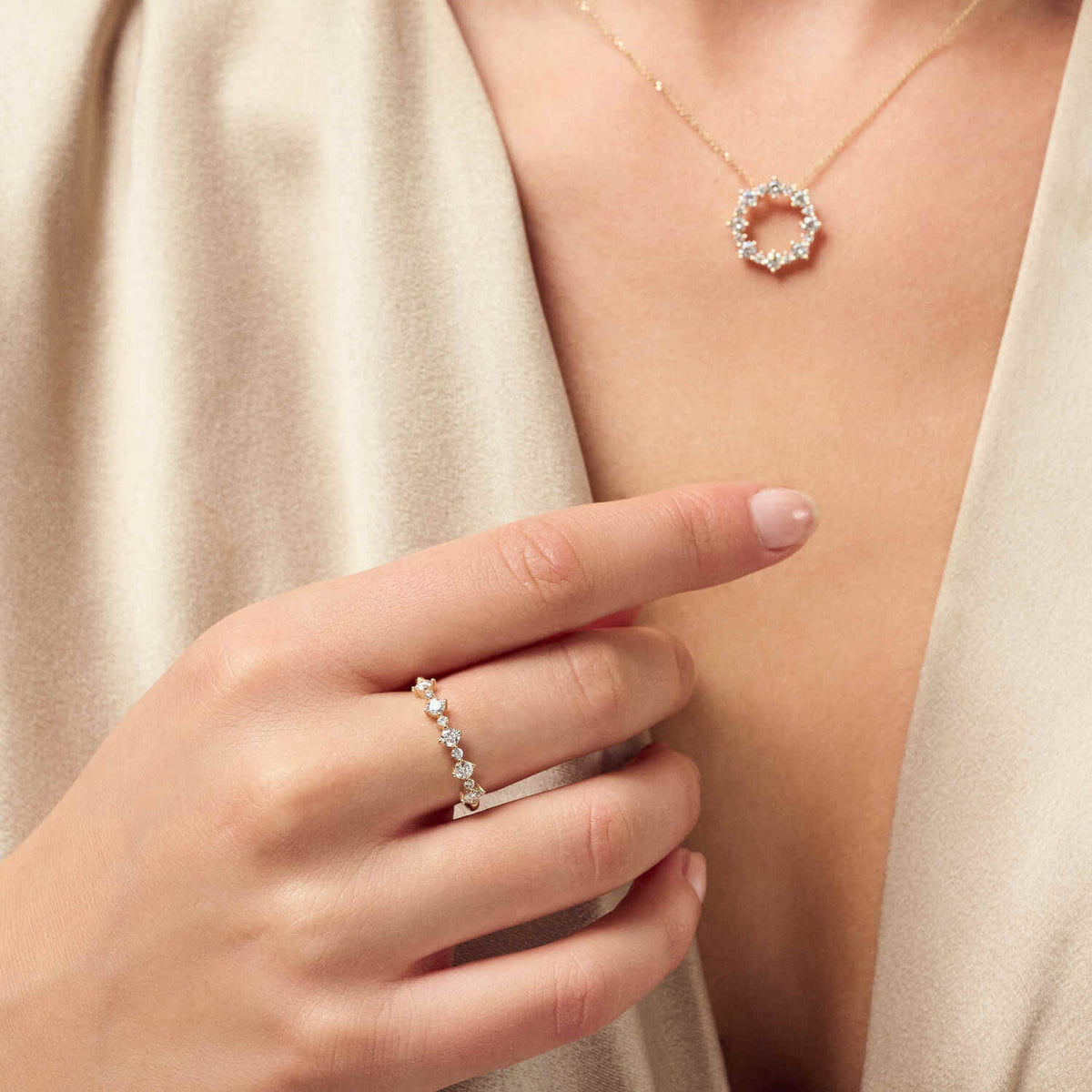 Elegant model showcasing the 14k White Gold Brina Diamond Ring SJ-R2535-WD-WG alongside a matching diamond necklace, exemplifying refined style with gemstones.