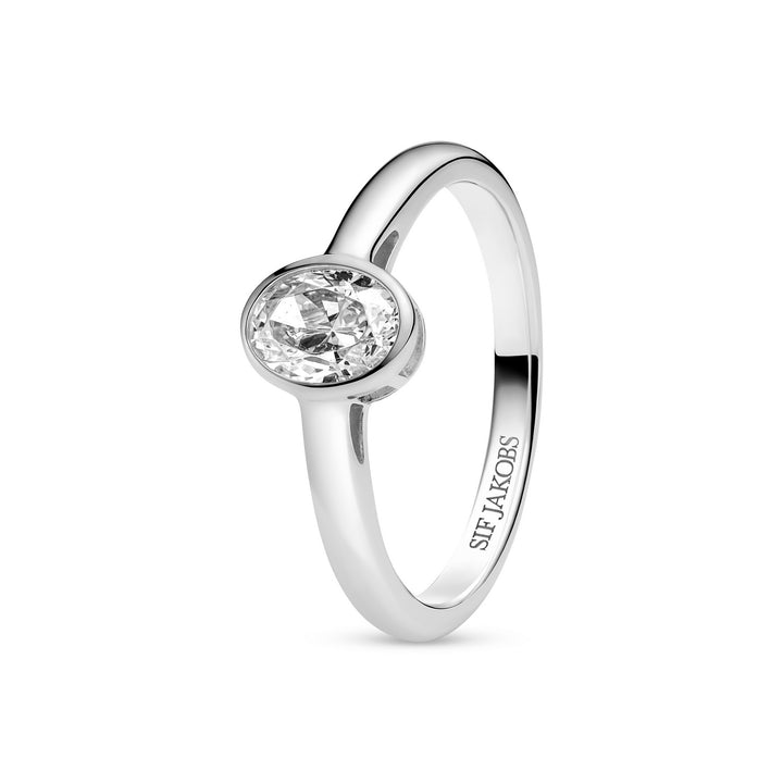 Silver ring with a clear gemstone on a white background
