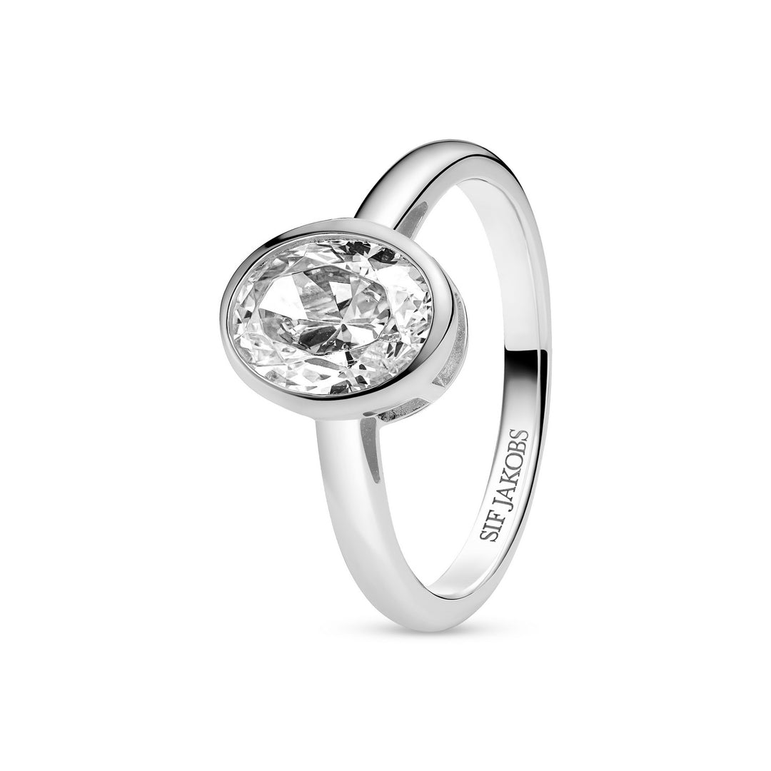 Silver ring with a clear gemstone on a white background