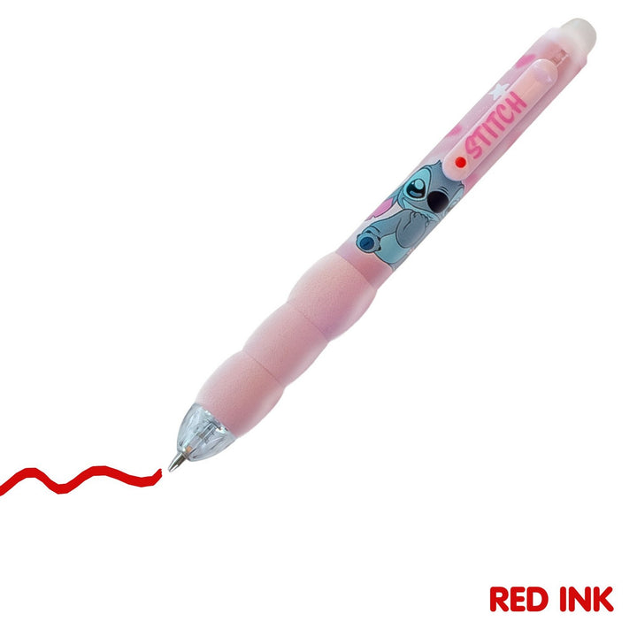 Pink pen with character design on a white background, showing red ink trail.