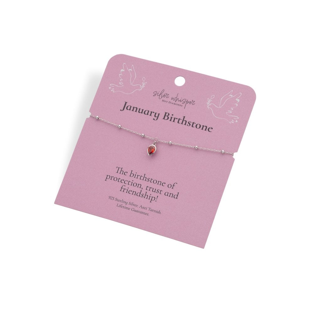 Bracelet with a red gemstone on a pink card with text