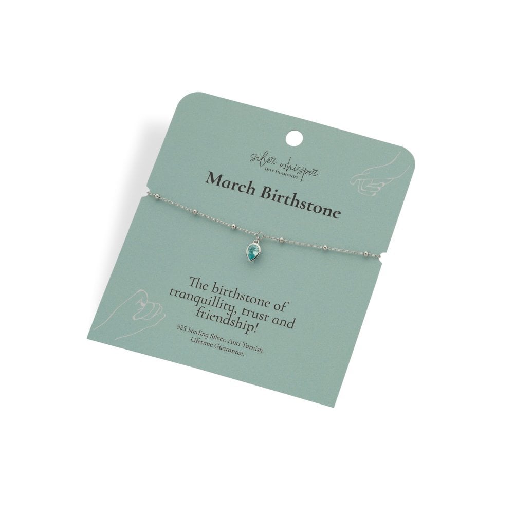 Silver bracelet with a green gemstone on a green card with text about March birthstone