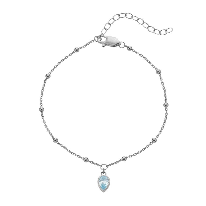 Silver bracelet with a teardrop-shaped blue gemstone 