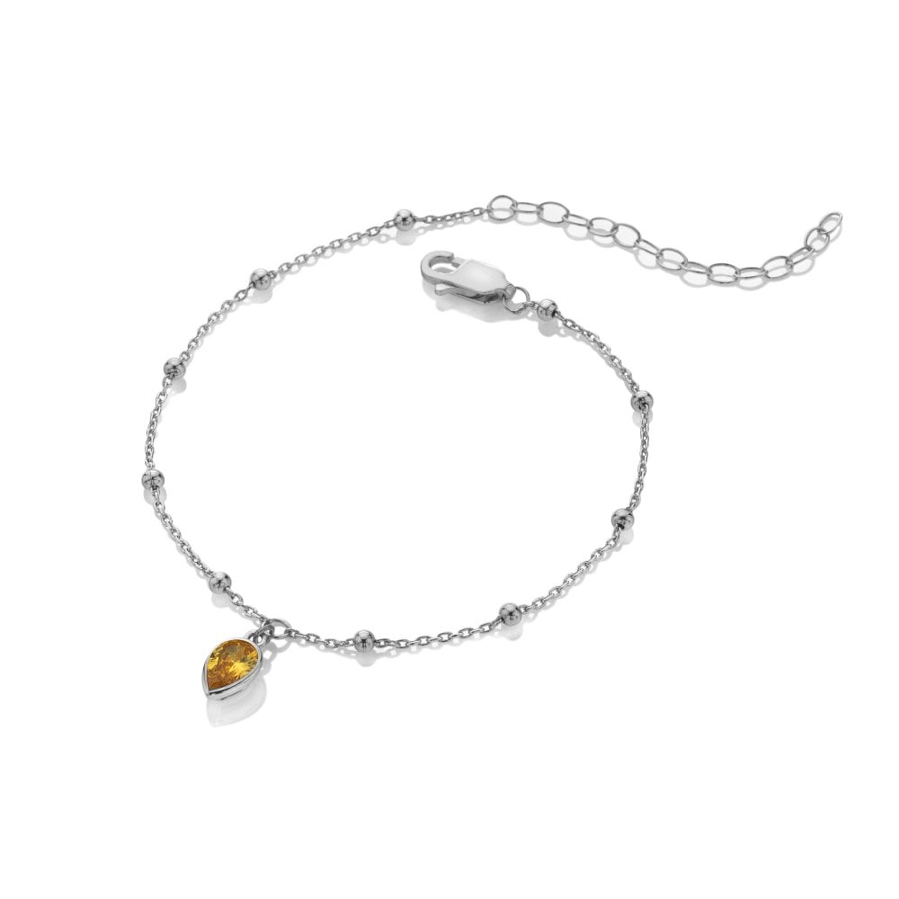 Silver bracelet with a heart-shaped yellow gemstone 