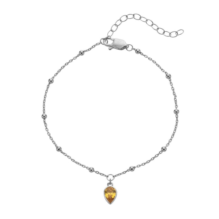 Silver bracelet with a teardrop-shaped amber pendant 