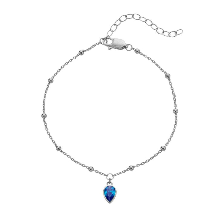 Silver bracelet with a blue teardrop pendant 