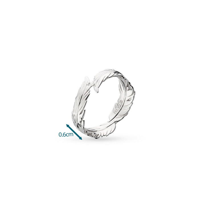 Silver ring with a detailed design on a white background