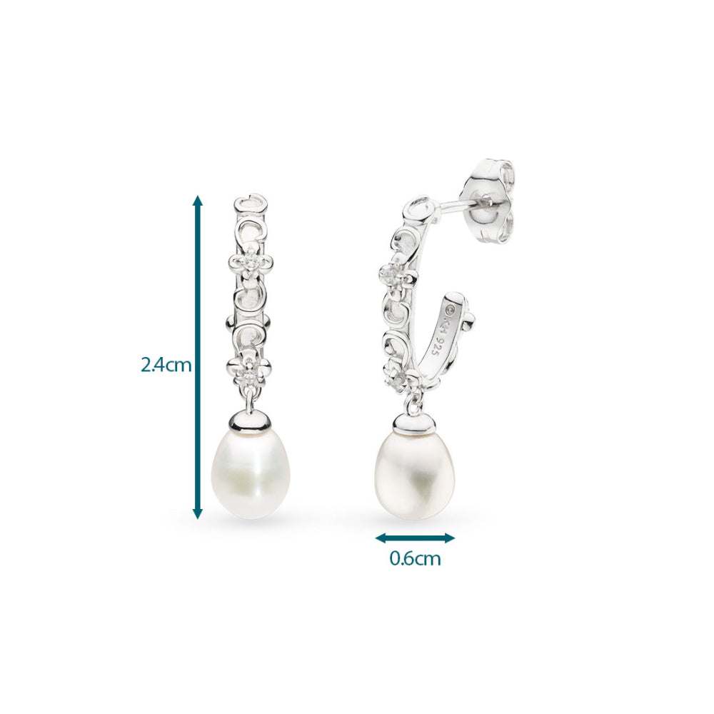 Pearl earrings with measurements on a white background