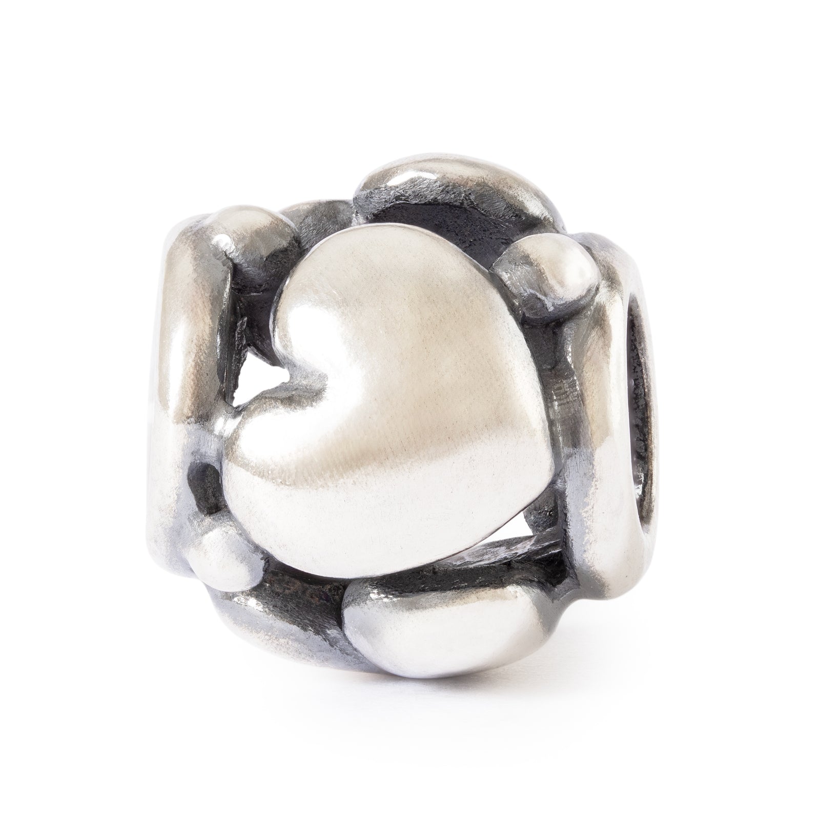 Silver heart-shaped charm on a white background