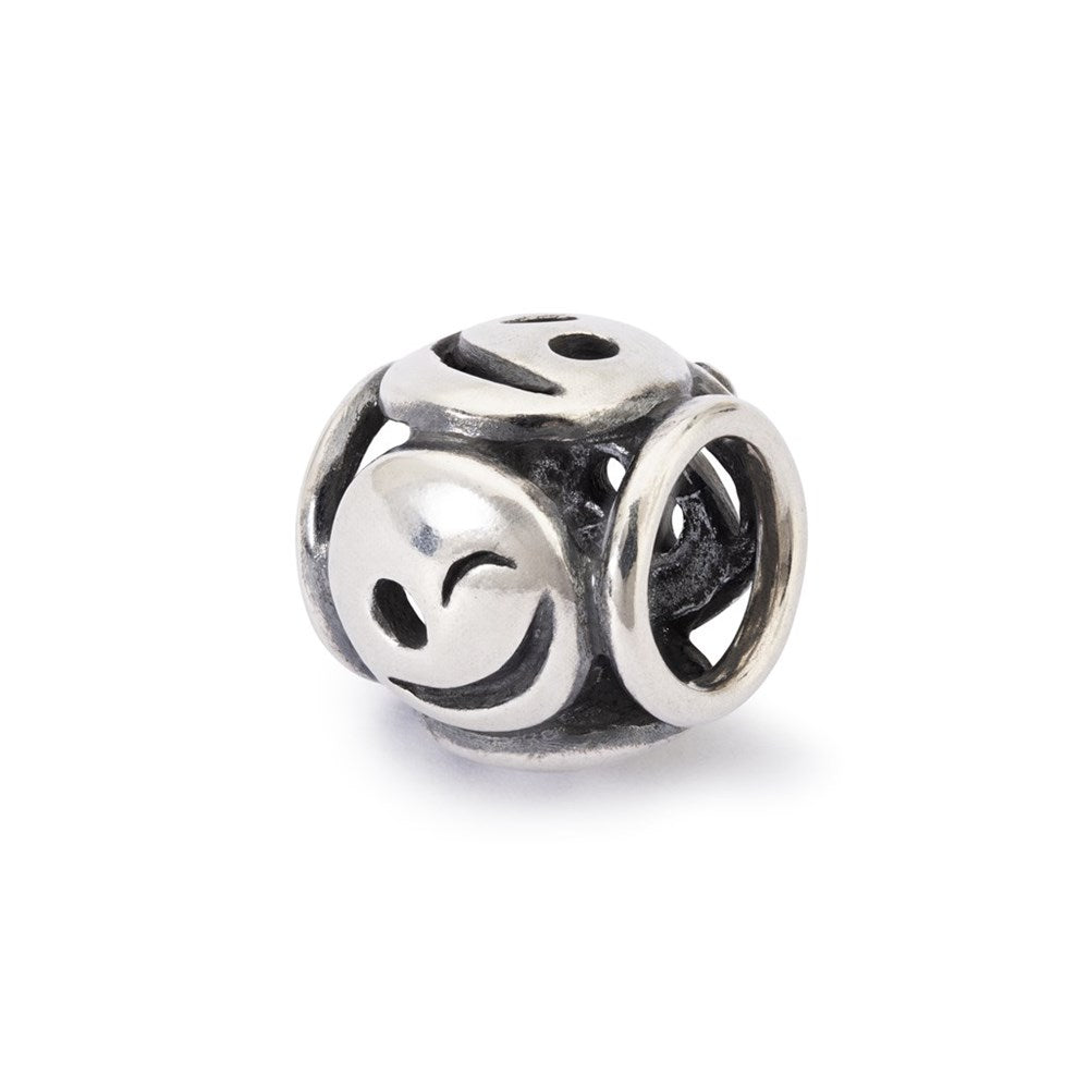 Silver bead charm with smiley face design on a white background