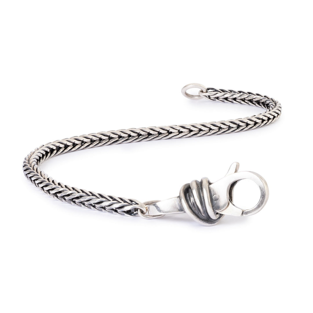 Silver braided bracelet with a clasp on a white background