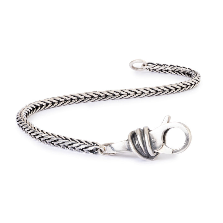 Silver braided bracelet with a clasp on a white background