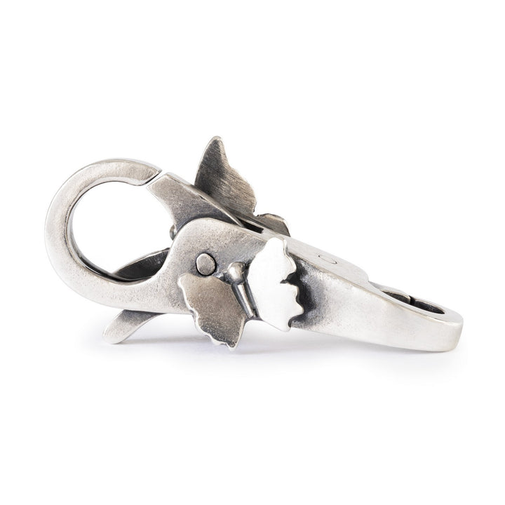 Silver ring with a unique design on a white background