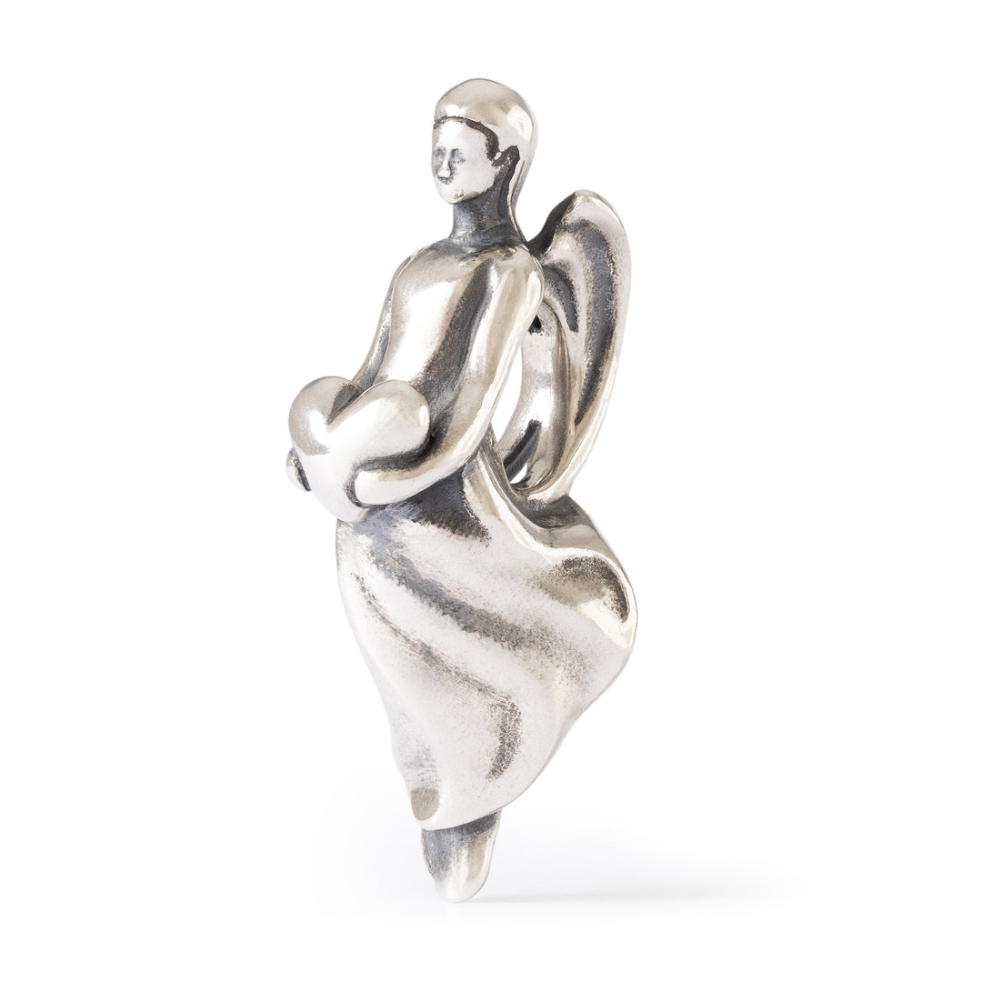 Silver angel figurine on a white background