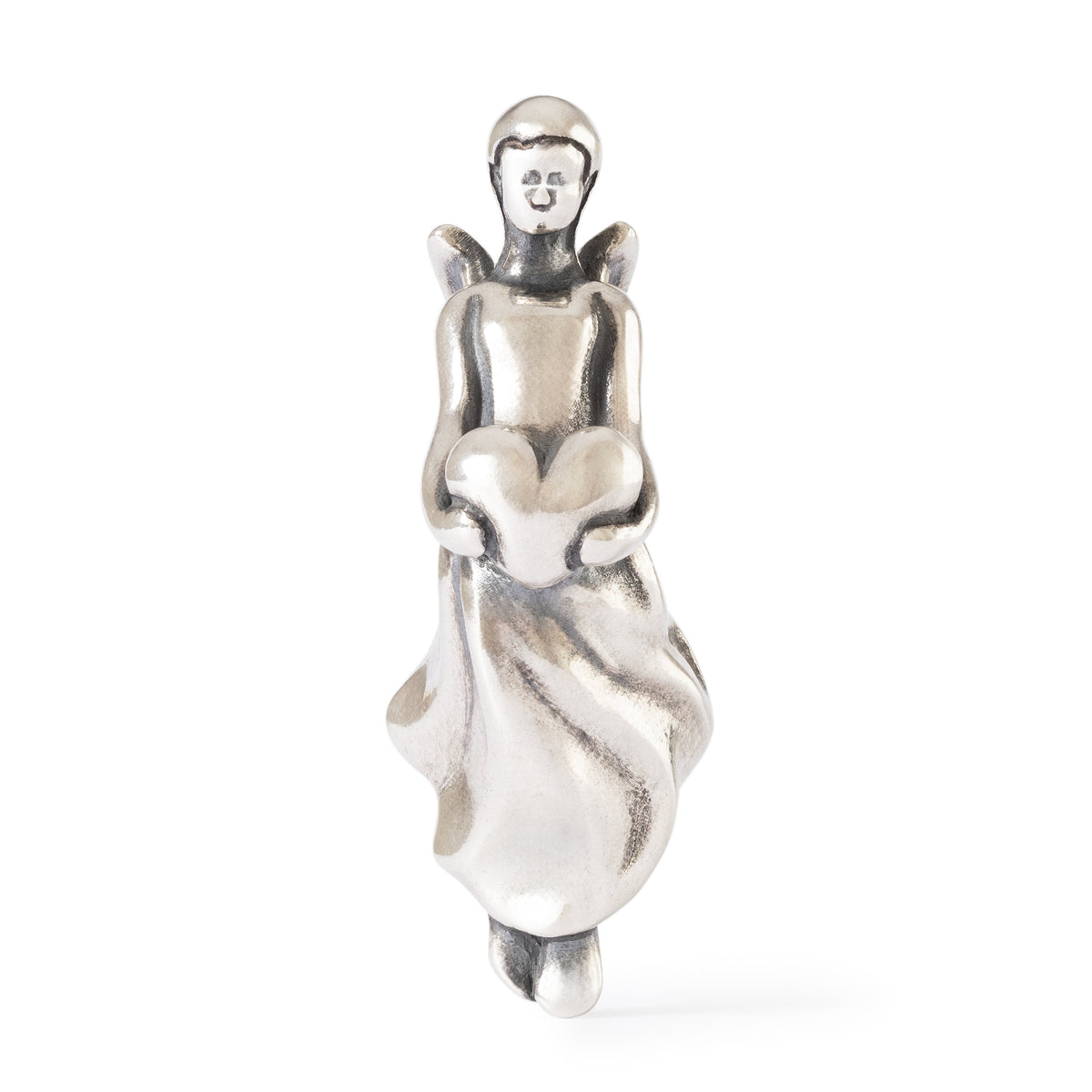 Silver figurine of a woman holding a heart on a white background