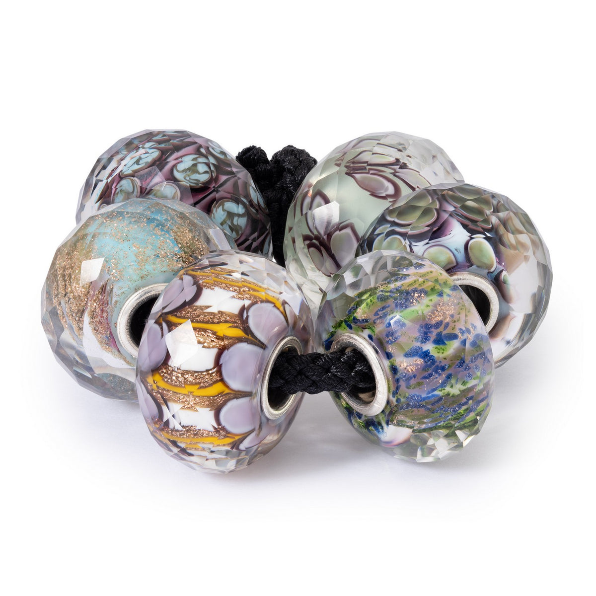 Set of colorful glass beads on a white background