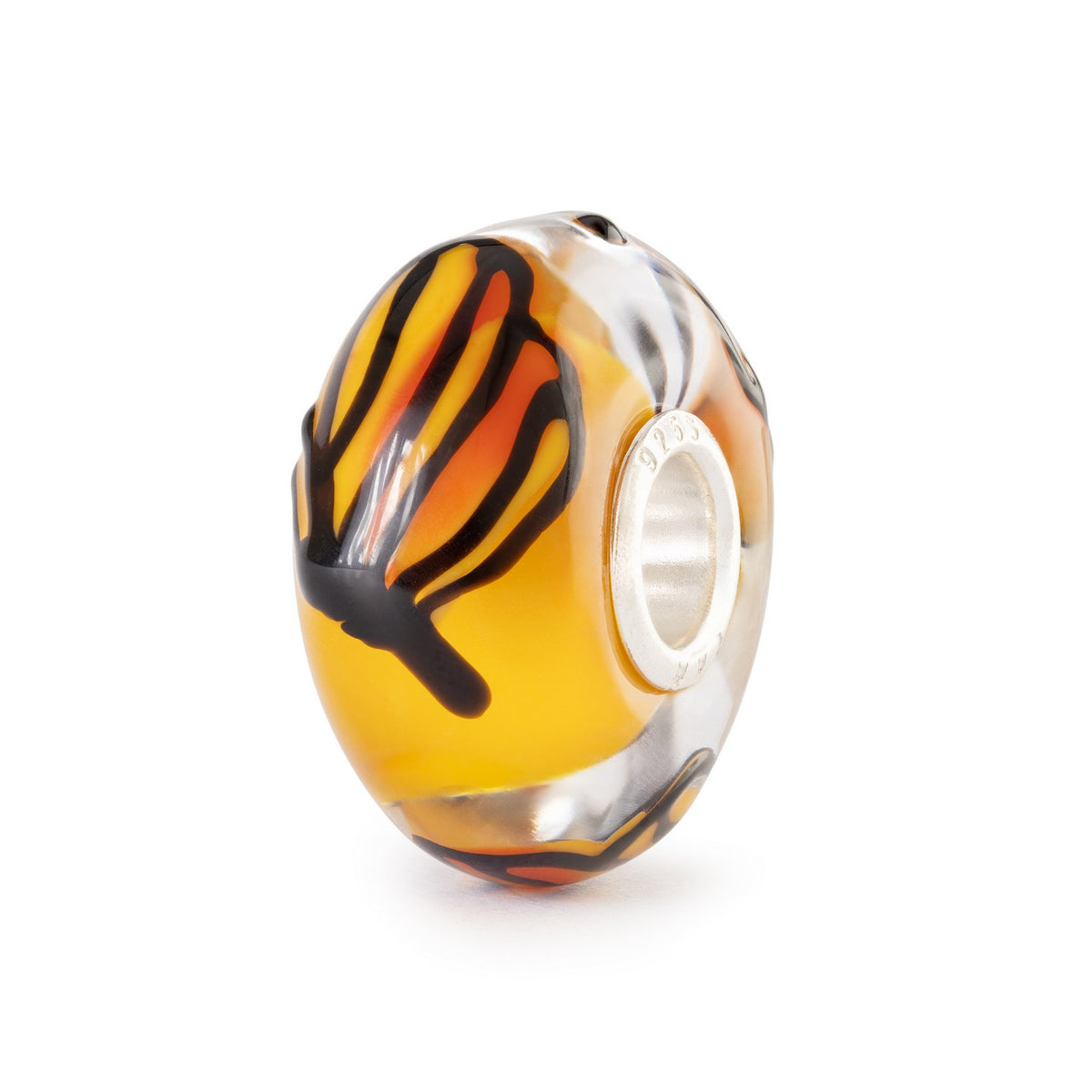 Glass charm with orange, black, and clear design on a white background