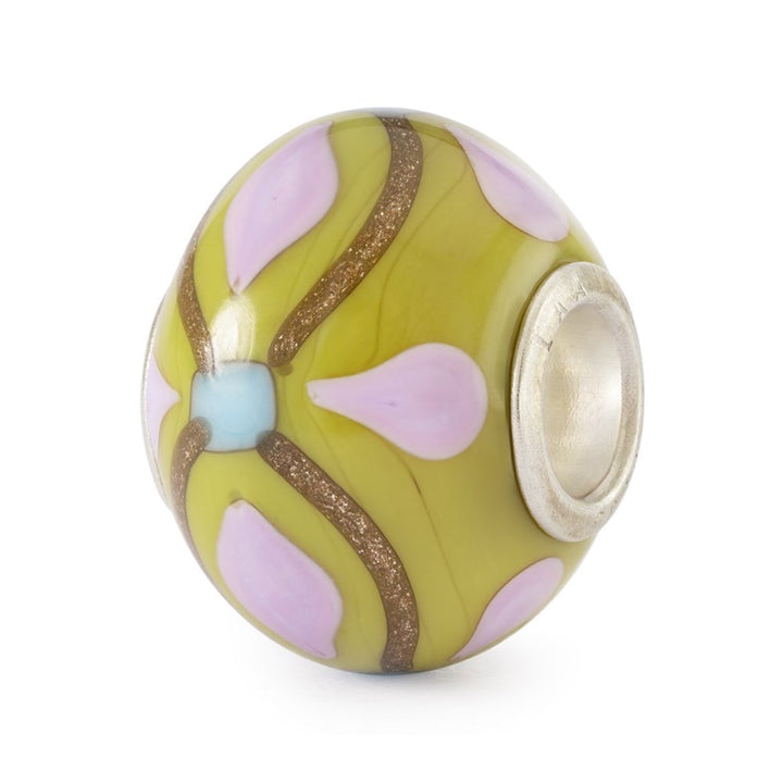 Decorative bead with floral patterns on a white background