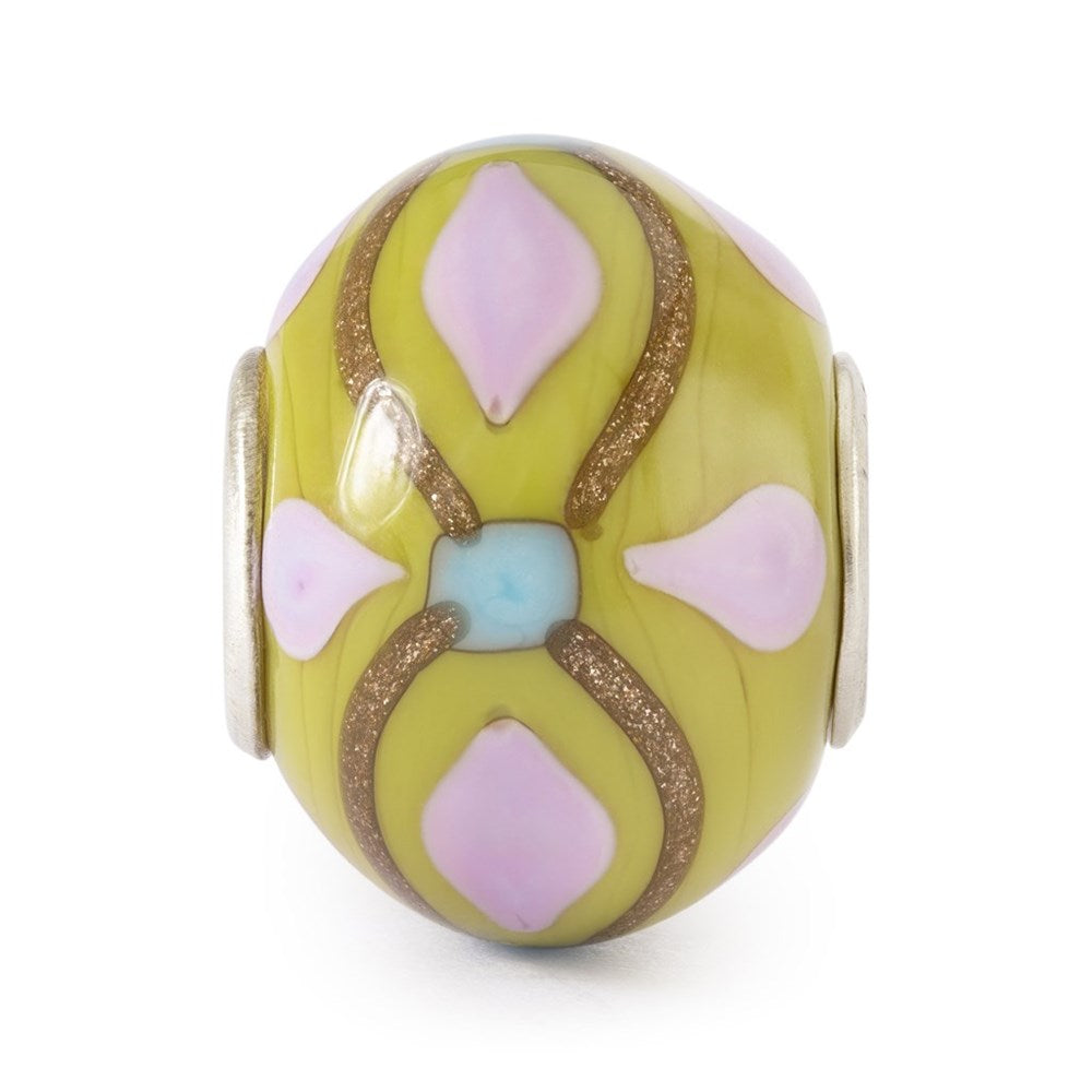 Decorative bead with geometric patterns on a white background