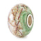 Decorative bead with green, white, and gold patterns on a white background