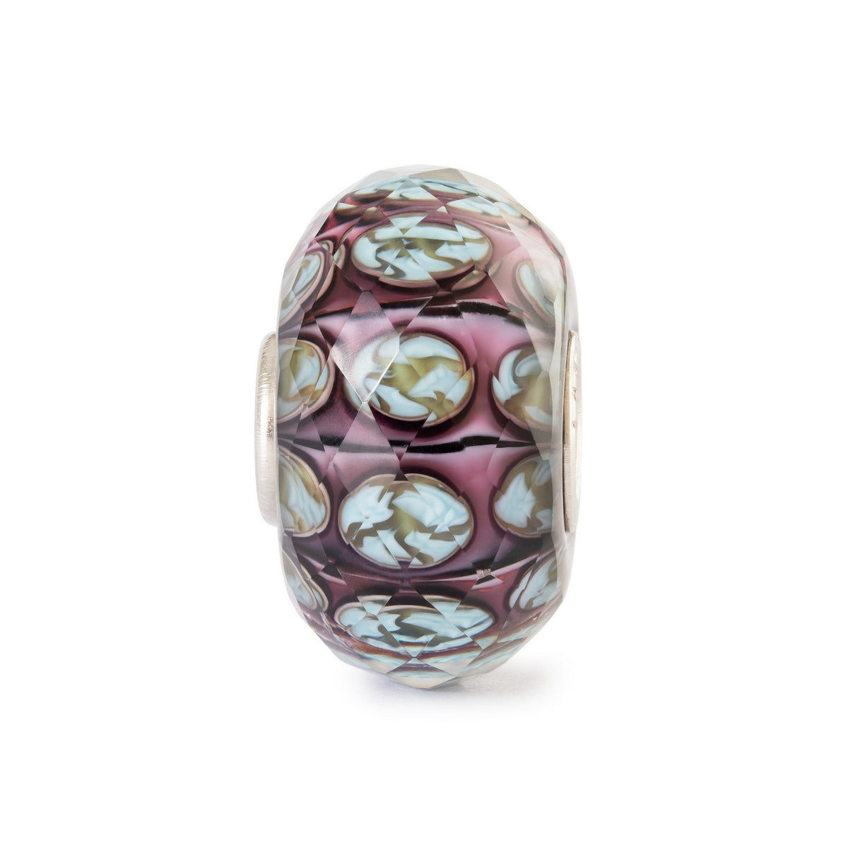 Multicolored glass bead with silver setting on a white background