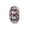 Multicolored glass bead with silver setting on a white background