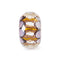 Decorative glass bead with geometric pattern on a white background