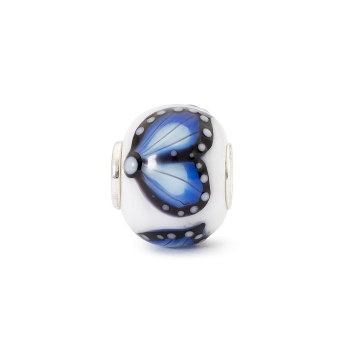 Butterfly-themed glass charm bead on a white background