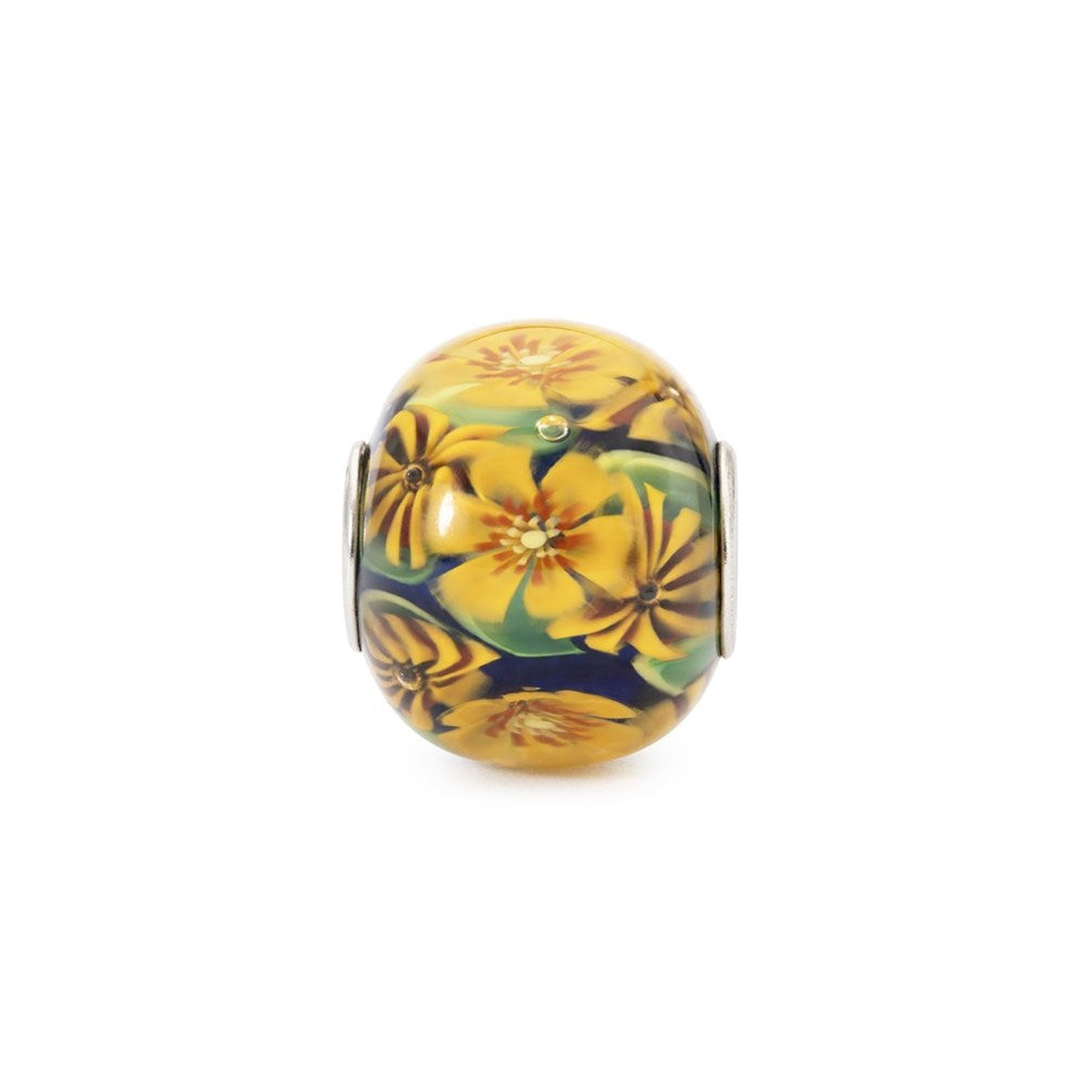 Decorative bead with floral design on a white background